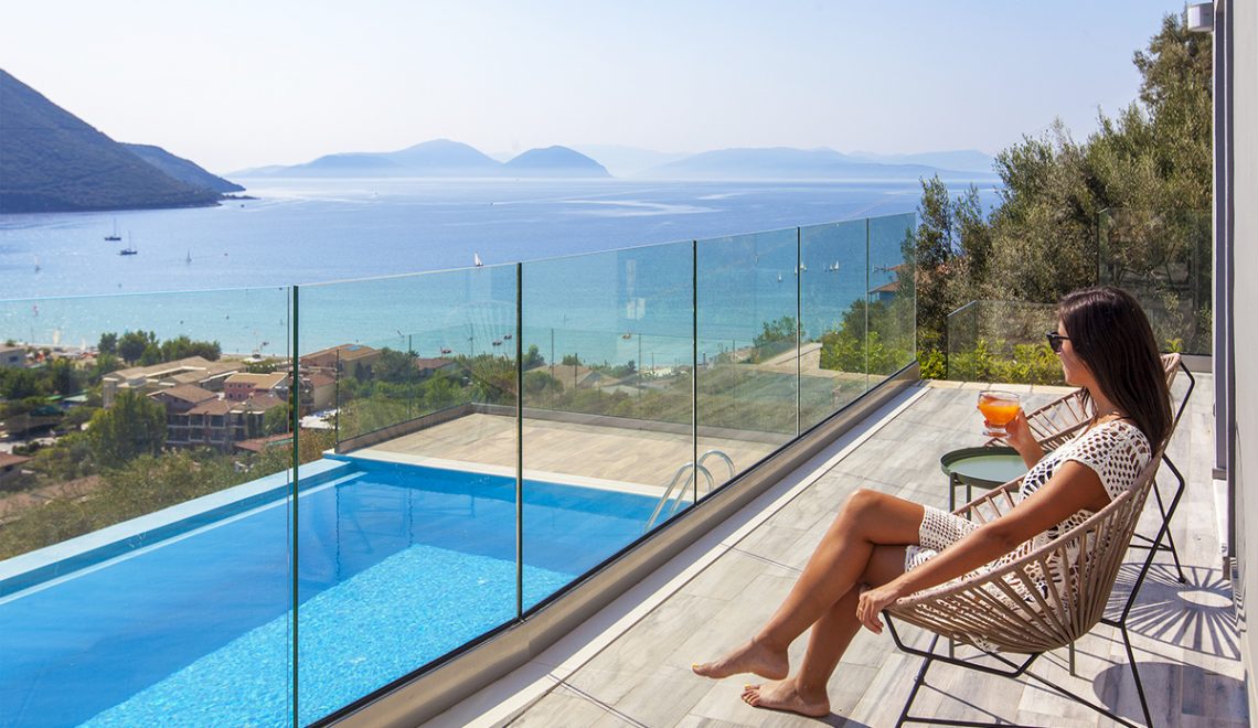 Villa Irene-Drakatos Villas in vasiliki lefkada greece, girl admiring the view from the balcony's pool area