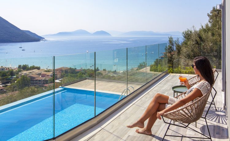 Villa Irene-Drakatos Villas in vasiliki lefkada greece, girl admiring the view from the balcony's pool area