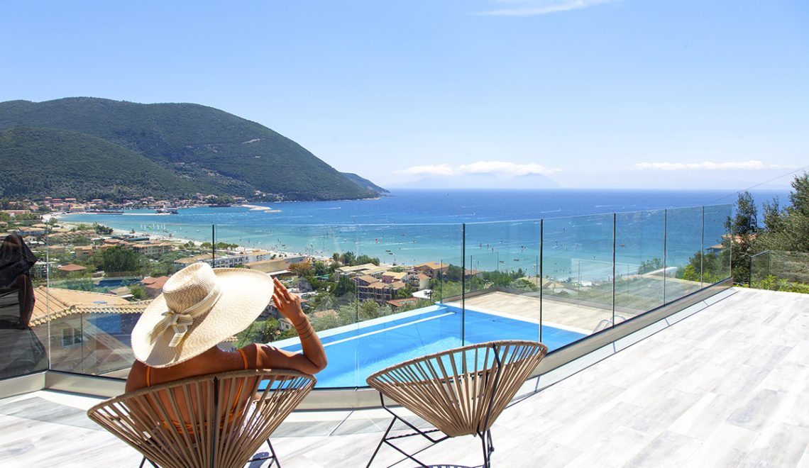 Villa Irene in vasiliki lefkada greece, girl seating outdoors and admiring the panoramic view