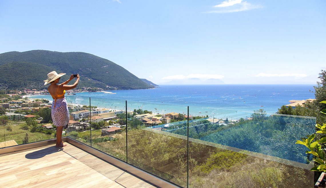 Villa Irene in vasiliki lefkada, a girl taking photos of the breathtaking panoramic view