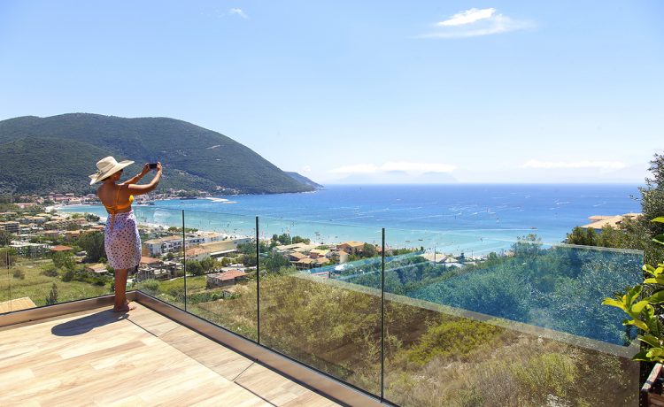 Villa Irene in vasiliki lefkada, a girl taking photos of the breathtaking panoramic view