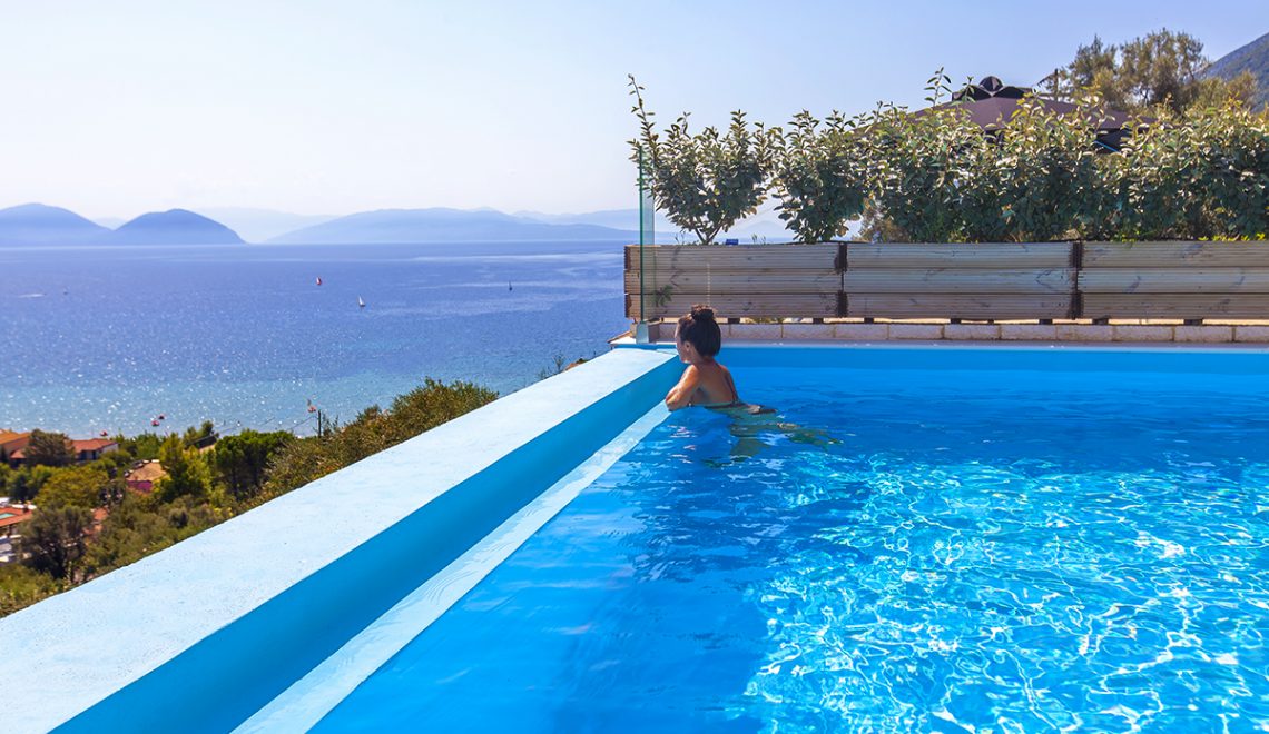 Villa maria in vasiliki lefkada greece, the pool with a girl swimming and the panoramic view you can admire