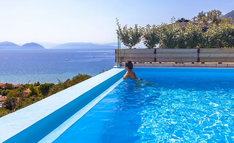 Villa maria in vasiliki lefkada greece, the pool with a girl swimming and the panoramic view you can admire